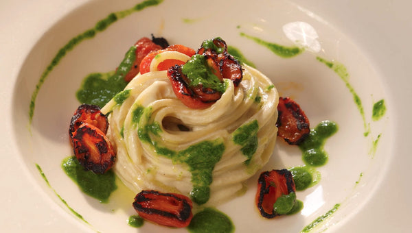 Durum wheat linguine with smoked aubergine, datterino tomatoes and basil sauce